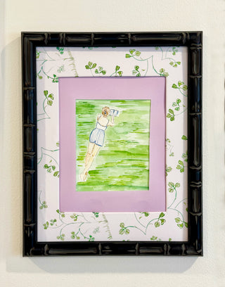 Framed artwork of a person holding a newspaper on a green background with a black frame.