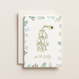 Greeting card with champagne illustration and floral border on a beige background