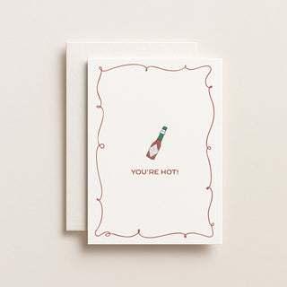 Greeting card with a bottle illustration and 'You're Hot!' text on a beige background